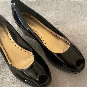 BCBG black patent leather wedges.